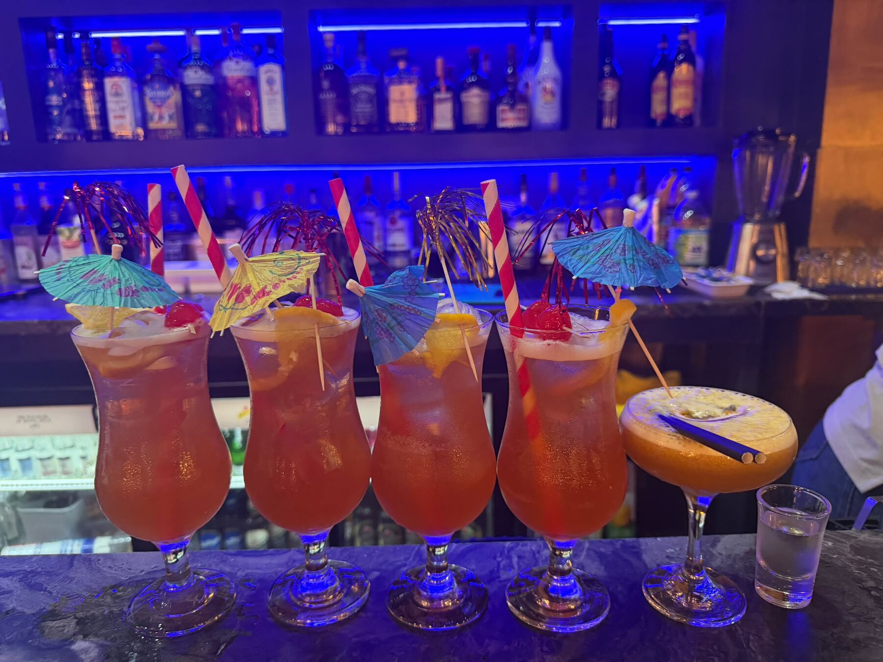 Cocktails lined up on the bar at Lavish by La Torre