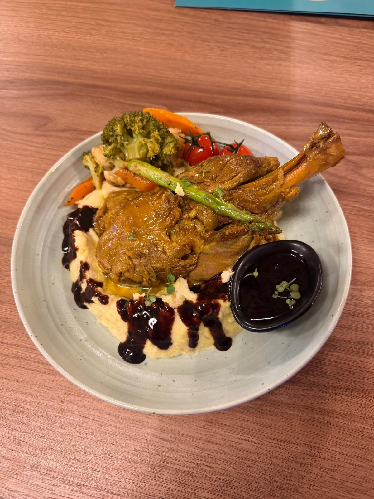 Slow-cooked lamb with mash and vegetables